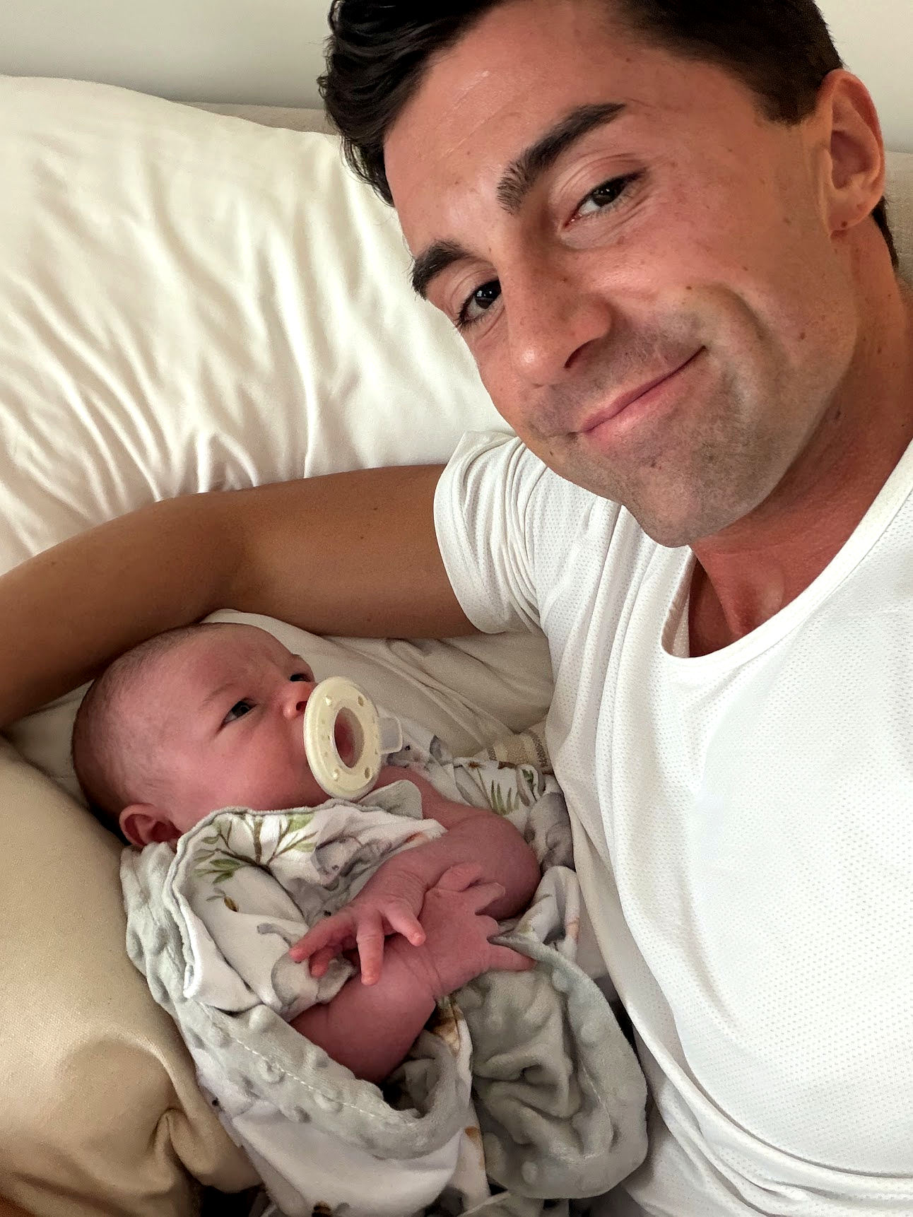 Dalton holding his newborn son
